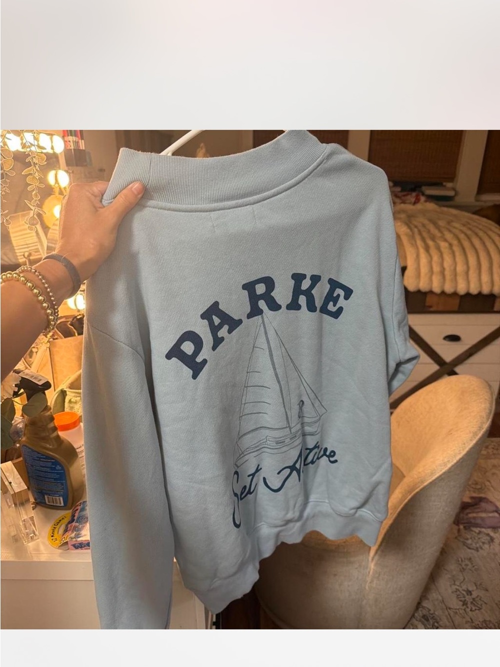 Parke So Active light blue sweatshirt with blue text and ship's wheel graphic